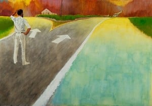 Man standing at a fork in a road with a choice to make