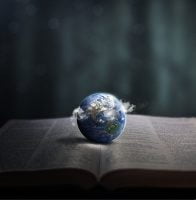 Earth Resting on Open Bible