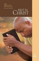 Man Praying While Holding Bible