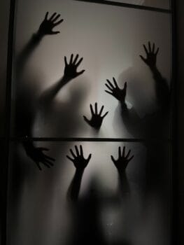 Hands of people reaching out for help