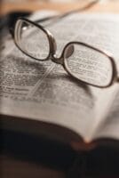 tilt-shift photography of eyeglasses with silver-colored frames